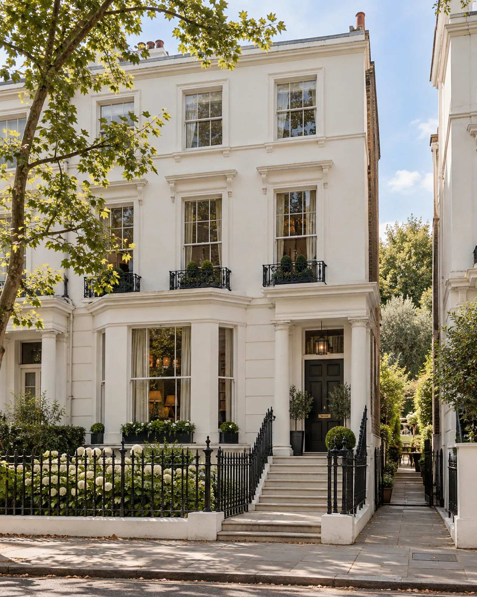 White stucco terrace with black railings